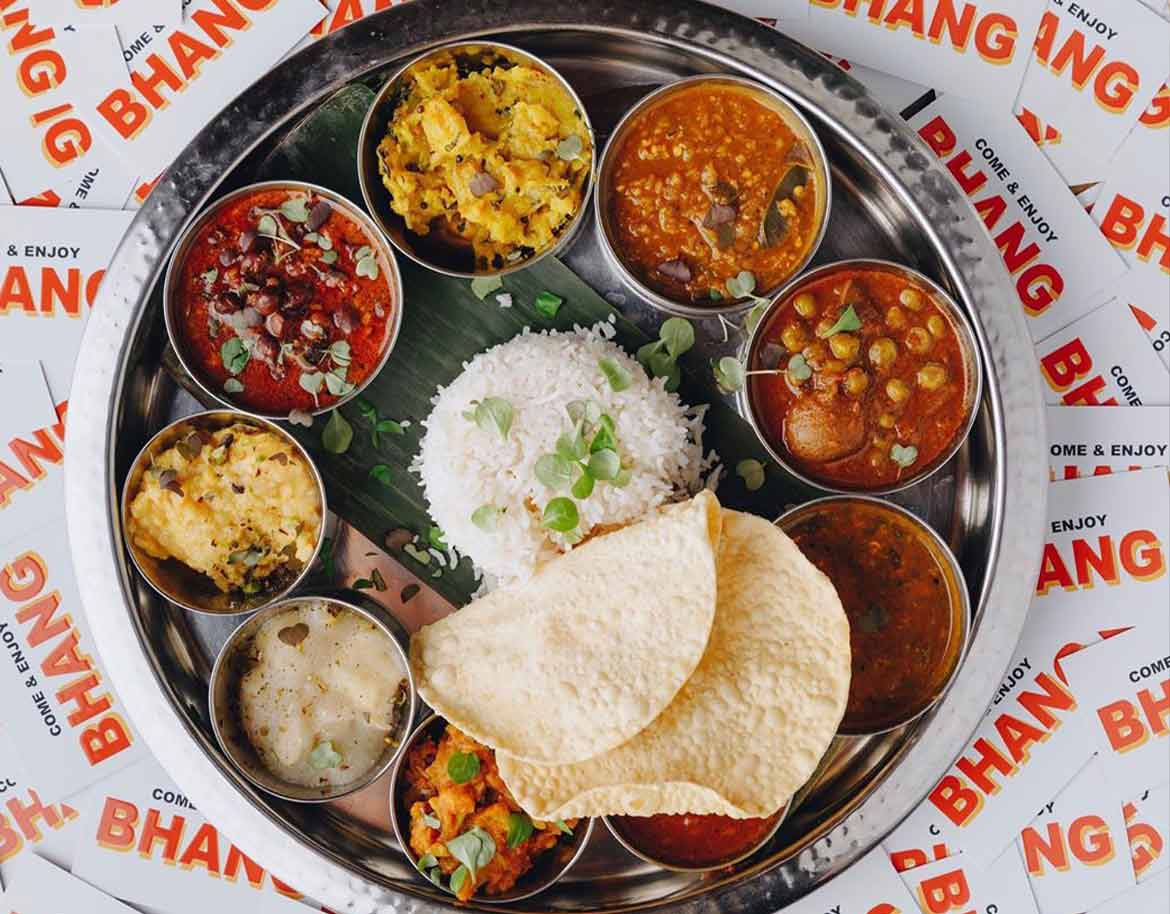 Bhang-Indian-Cuisine- mini bowls of curry and rice in a circle