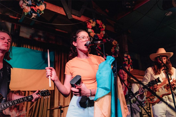 the-retreat-hotel a girl singing on stage at the retreat hotel