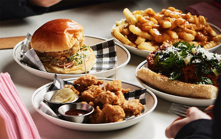juanita-peaches-restaurant burgers and fries sitting on a table
