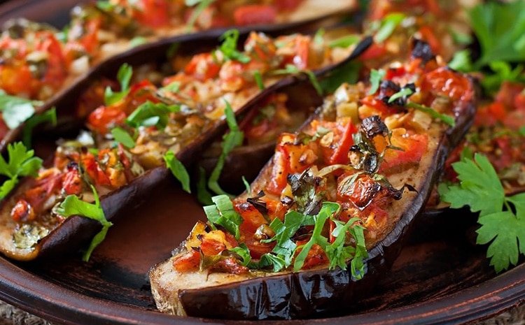 stuffed-eggplant stuffed eggplant sitting on a plate