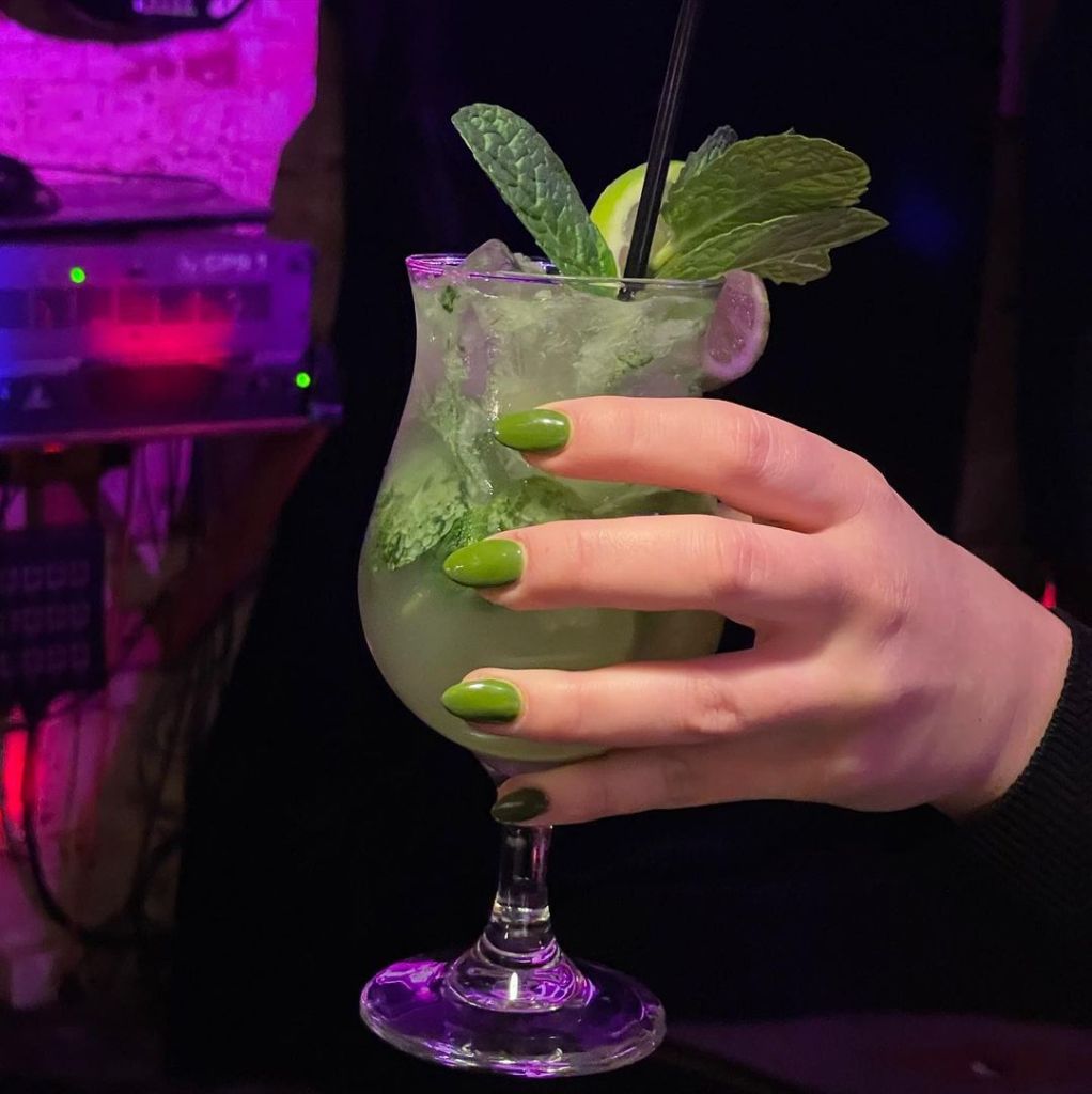 bar oussou cocktails a cocktail in someone's hand